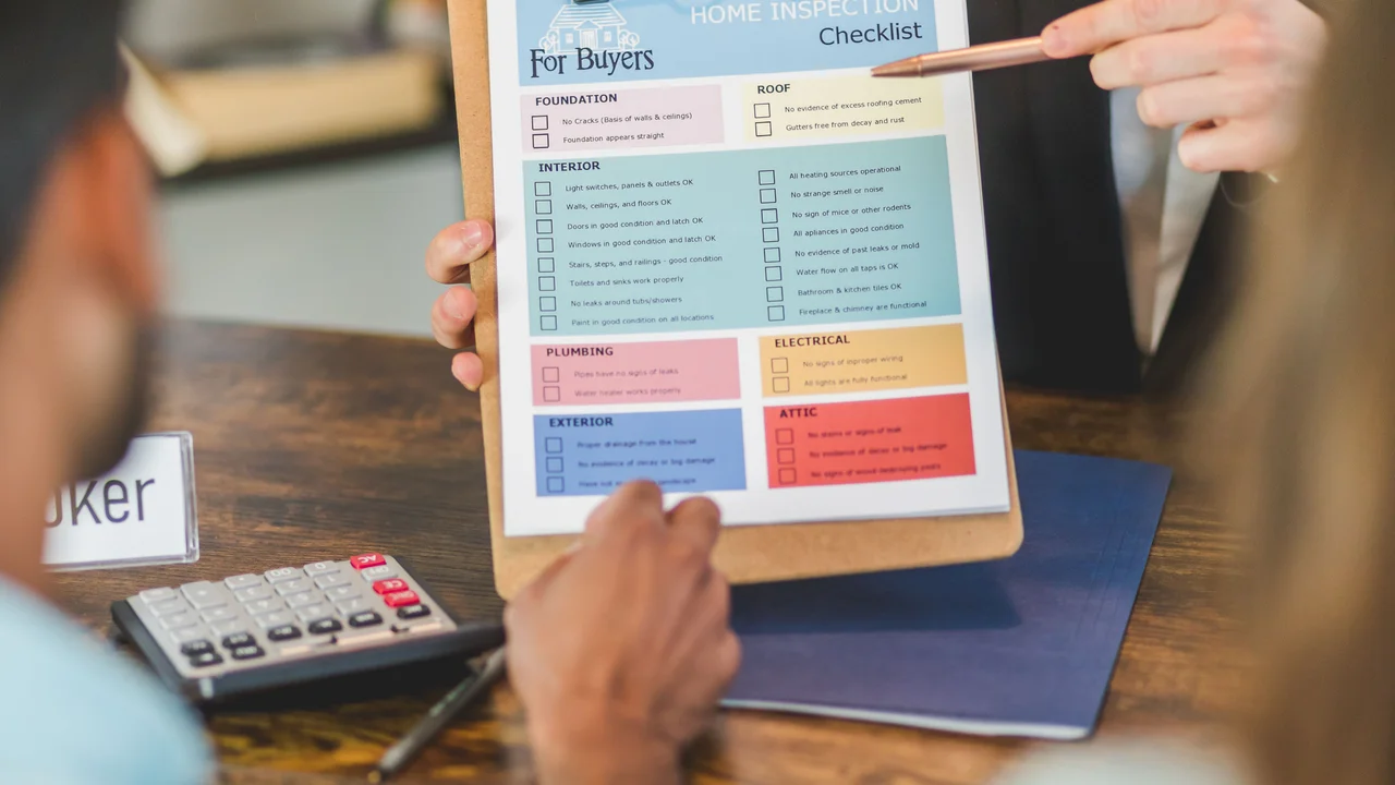 Landlord with inspection checklist clipboard at UK rental property